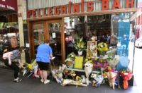 Crowds gathered at the famous cafe to lay flowers in remembrance of its proprietor Sisto Malaspina, who was stabbed to death in a terror attack