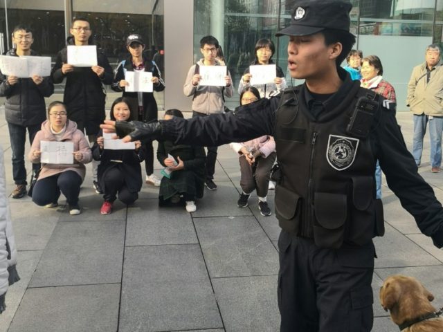 Police detain two students outside Beijing Apple store