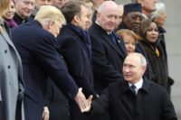 Russian President Vladimir Putin (R) shakes hands with US counterpart Donald Trump before a ceremony at the Arc de Triomphe in Paris on November 11, 2018 as part of commemorations marking the 100th anniversary of the 1918 armistice