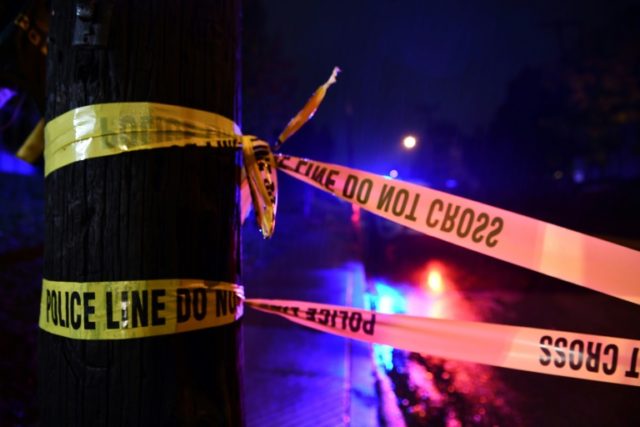 US policeman fatally shoots black guard who detained gunman