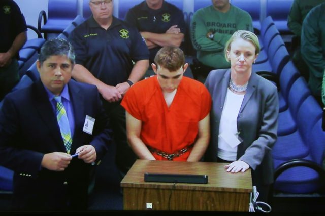 Florida school shooter accused of assaulting guard