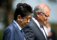 Japan's Prime Minister Shinzo Abe (L) and Australian Prime Minister Scott Morrison (R) paid their respects at memorials to the war dead at the Darwin Cenotaph