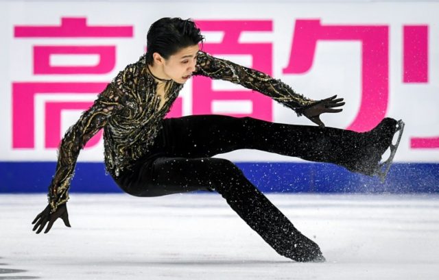Two-time Olympic champion Hanyu survives fall to win in Moscow