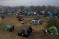 Volunteers set up camp for California wildfire evacuees outside a supermarket in Chico, near the devastated community of Paradise