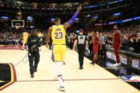 Los Angeles Lakers star LeBron James waves to a cheering Cleveland crowd in the first quarter of a 109-105 NBA victory Wednesday over the Cavaliers, the club where he spent 11 seasons