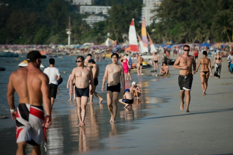 Chinese Tourist on the Beach