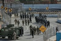 US troops and border patrol agents rushed to a border crossing between San Diego, California and Tijuana, Mexico to stop hundreds of migrants trying to clamber over border fences