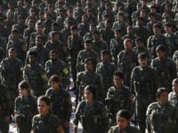 Fighters from the Syrian Democratic Forces (SDF), hold a military parade during the funeral of a fellow fighter, killed during a military mission, in the northeastern Syria on November 11, 2018 Fighters from the Syrian Democratic Forces (SDF), hold a military parade during the funeral of a fellow fighter, killed during a military mission, in the northeastern Syria on November 11, 2018