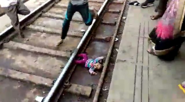 Indian baby survives being run over by train