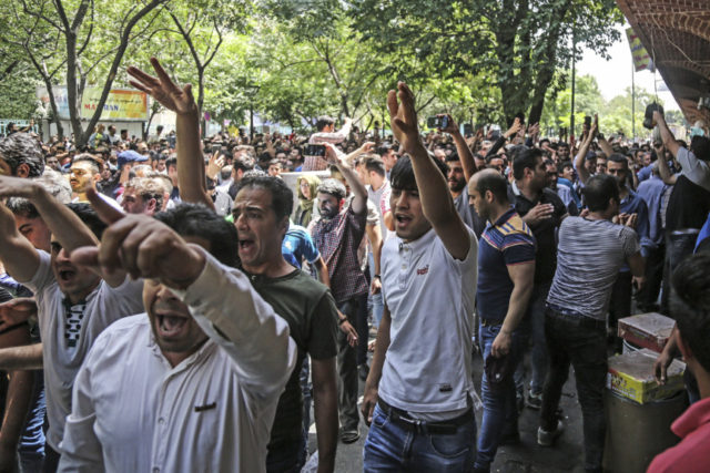 8dbf1d_iran-economy-sanctions-28942-in-25-2018-file-photo-group-protesters-chant-640x427.jpg