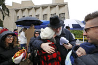 APTOPIX Shooting Synagogue Chuck Diamond Rabbi Chuck Diamond, center, a former Rabbi at the Tree of Life Synagogue, hugs a woman after leading a Shabbat service outside the Tree of Life Synagogue, Saturday, Nov. 3, 2018 in Pittsburgh. Last Saturday, 11 people were killed and six wounded when their worship was interrupted by a gunman's bullets. (AP Photo/Gene J. Puskar) Chuck Diamond