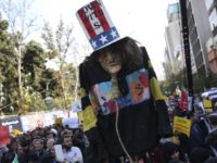 Iran US An effigy of U.S. government icon "Uncle Sam" is held up by demonstrators during a rally in front of the former U.S. Embassy in Tehran, Iran, on Sunday, Nov. 4, 2018, marking the 39th anniversary of the seizure of the embassy by militant Iranian students. Thousands of Iranians rallied in Tehran on Sunday to mark the anniversary as Washington restored all sanctions lifted under the nuclear deal. (AP Photo/Vahid Salemi) An effigy of U.S. government icon "Uncle Sam" is held up by demonstrators during a rally in front of the former U.S. Embassy in Tehran, Iran, on Sunday, Nov. 4, 2018, marking the 39th anniversary of the seizure of the embassy by militant Iranian students. Thousands of Iranians rallied in …