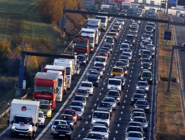 Climate Europe In this Nov. 6, 2017 file photo cars and trucks queue on the highway A5 in Frankfurt, Germany. The European Union’s executive branch proposed Wednesday that the bloc should cut its emissions of greenhouse gases to net zero by 2050, a measure scientists say needs to be adopted worldwide in order to avoid catastrophic global warming. (AP Photo/Michael Probst, file) The Associated Press