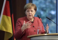 The Latest: Merkel on her way to G20 after plane trouble