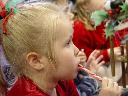 Girl eating a candy cane
