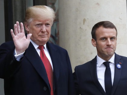 French President Emmanuel Macron, right, grimaces as he welcomes U.S President Donald Trump at the Elysee Palace in Paris, Saturday, Nov.10, 2018. Trump is joining other world leaders at centennial commemorations in Paris this weekend to mark the end of World War I. (AP Photo/Thibault Camus)