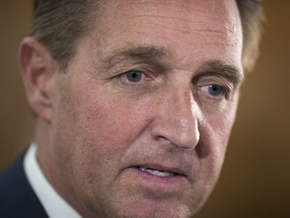 Sen. Jeff Flake, R-Ariz., a member of the Senate Foreign Relations Committee, speaks with