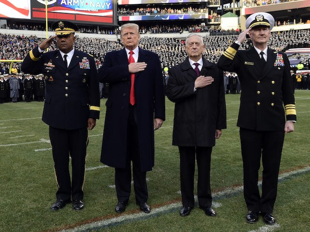 President Donald Trump, second from left, is joined by, from left, West Point Superintendent Lt. Gen. Darryl A. Williams, Defense Secretary Jim Mattis and Naval Academy Superintendent Vice Adm. Ted Carter, during the playing of the national anthem before the start of the Army-Navy NCAA college football game in Philadelphia, …