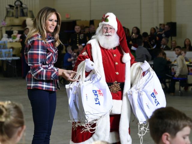 First lady Melania Trump speaks as she stands next to Santa during a Toys for Tots event a