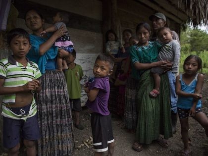 Members of the Caal Maquin family and neighbors stand in front of Claudia Maquin's house in Raxruha, Guatemala, on Saturday, Dec. 15, 2018. Claudia Maquin's daughter, 7-year-old Jakelin Amei Rosmery Caal, died in a Texas hospital, two days after being taken into custody by border patrol agents in a remote …