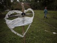 Guatemala Child Dead Border Patrol A heart-shaped sign displays the name of Jakelin Amei Rosmey Caal in Raxruha, Guatemala, on Saturday, Dec. 15, 2018. The 7-year-old girl died in a Texas hospital, two days after being taken into custody by border patrol agents in a remote stretch of New Mexico desert. (AP Photo/Oliver de Ros)