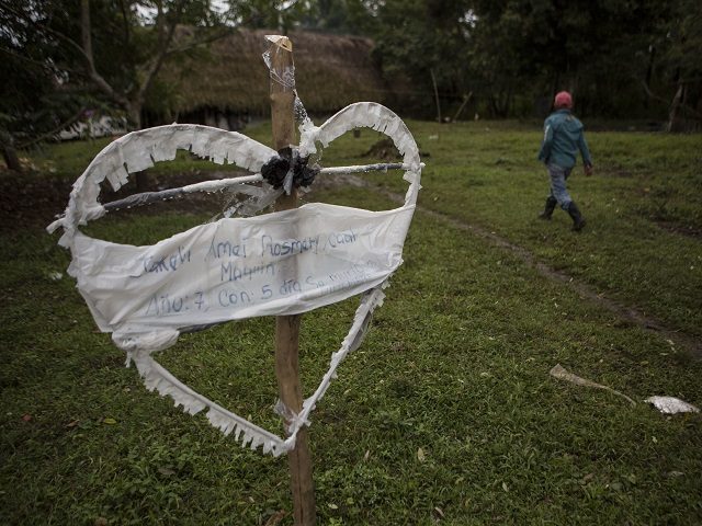 A heart-shaped sign displays the name of Jakelin Amei Rosmey Caal in Raxruha, Guatemala, on Saturday, Dec. 15, 2018. The 7-year-old girl died in a Texas hospital, two days after being taken into custody by border patrol agents in a remote stretch of New Mexico desert. (AP Photo/Oliver de Ros)