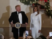 Donald Trump, Melania Trump President Donald Trump, joined by first lady Melania Trump, speaks during the Congressional Ball in the Grand Foyer of the White House in Washington, Saturday, Dec. 15, 2018. (AP Photo/Carolyn Kaster)