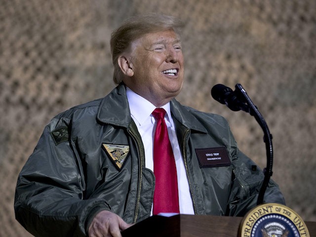 President Donald Trump speaks at a hanger rally at Al Asad Air Base, Iraq, Wednesday, Dec.