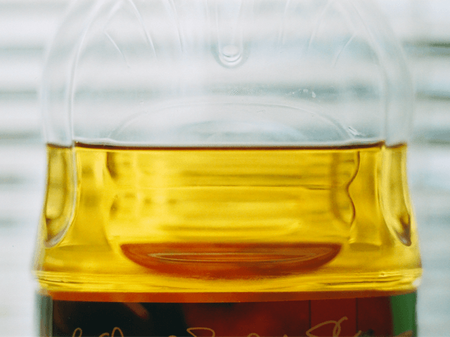 Clarified apple juice, from which pectin and starch have been removed, in a plastic bottle