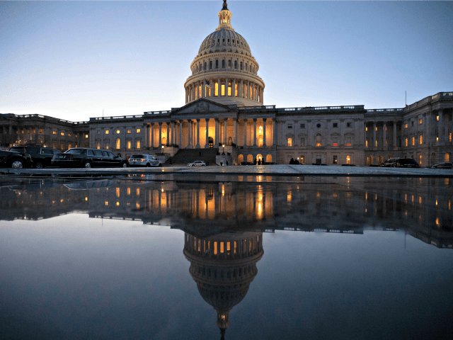 The Capitol is seen at day's end as the Senate works on a House-passed bill that would pay