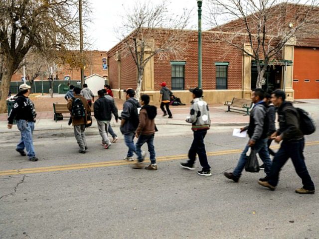 Central American migrants are pictured making their way to El Paso Sun Metro busses after