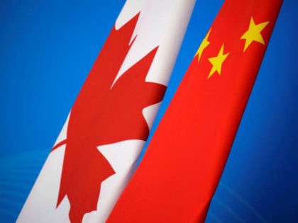 Flags of Canada and China are placed for the first China-Canada economic and financial strategy dialogue in Beijing, China, Monday, Nov. 12, 2018. (Jason Lee/Pool Photo via AP)