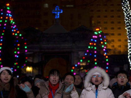 Chinese catholics attend a Christmas Eve Mass service at the official Catholic church Sout