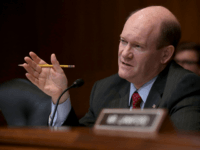 Senate Appropriations Committee's Financial Services and General Government Subcommittee ranking member Sen. Chris Coons (D-DE) questions U.S. Treasury Secretary Steven Mnuchin during a hearing in the Dirksen Senate Office Building on Capitol Hill May 22, 2018 in Washington, DC. Mnuchin testified that the U.S. didn't mean to 'put ZTE out …
