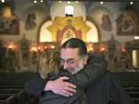 Christmas Miracle Rev. Nicholas Jonas hugs a longtime parishioner of Holy Trinity Greek Orthodox Church, which avoided being sold at auction, Friday, Dec. 14, 2018, in Chicago. The 120-year-old Chicago church was saved from auction after a midnight call from a group of donors, which one church official said was "a Christmas …