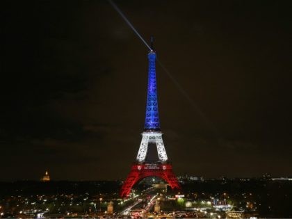 PARIS, FRANCE - NOVEMBER 16: The Eiffel Tower is illuminated in Red, White and Blue in honour of the victims of Friday's terrorist attacks on November 16, 2015 in Paris, France. Countries across Europe joined France today to observe a one minute-silence in an expression of solidarity with the victims …