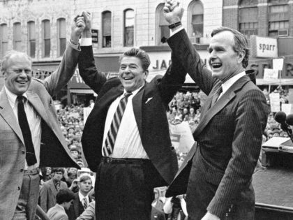 In this Nov. 3, 1980, file photo, former President Gerald Ford lends his support to Republican presidential candidate Ronald Reagan and his running mate, George H.W. Bush in Peoria, Ill. Bush has died at age 94. Family spokesman Jim McGrath says Bush died shortly after 10 p.m. Friday, Nov. 30, …