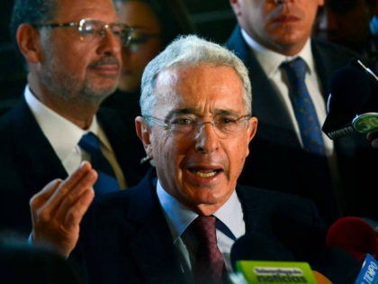 Former Colombian president (2002-2010) and senator Alvaro Uribe Velez (C) answers questions during a press conference at his residence in Rionegro, Antioquia department, Colombia on July 30, 2018. - Uribe has resigned from the senate on July 24, 2018 after he was formally placed under investigation by the Colombian Supreme …