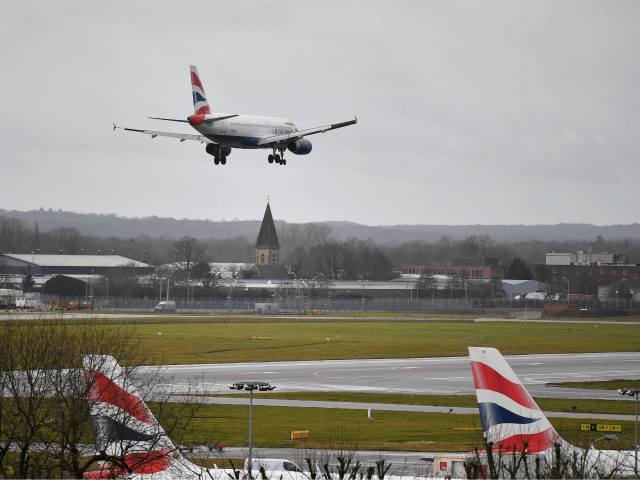 A British Airways Airbus 320-232 aircraft prepares to land at London Gatwick Airport, south of London, on December 21, 2018, as flights resumed following the closing of the airfield due to a drones flying. - British police were Friday considering shooting down the drone that has grounded flights and caused …