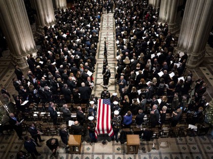WASHINGTON, DC - DECEMBER 05: (AFP OUT) The Honor Guard carries the casket of former U.S.