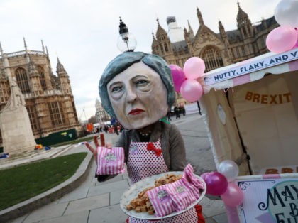 LONDON, ENGLAND - DECEMBER 10: A person dressed as a caricature of Prime Minister Theresa