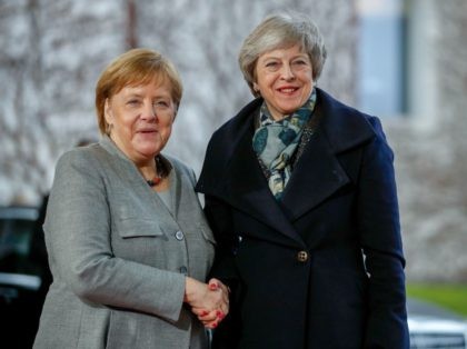 German Chancellor Angela Merkel (R) greets British Prime Minister Theresa May at the Chanc