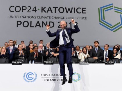 COP24 president Michal Kurtyka jumps at the end of the final session of the COP24 summit o