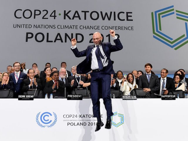 COP24 president Michal Kurtyka jumps at the end of the final session of the COP24 summit on climate change in Katowice, southern Poland, on December 15, 2018. (Photo by Janek SKARZYNSKI / AFP) (Photo credit should read JANEK SKARZYNSKI/AFP/Getty Images)