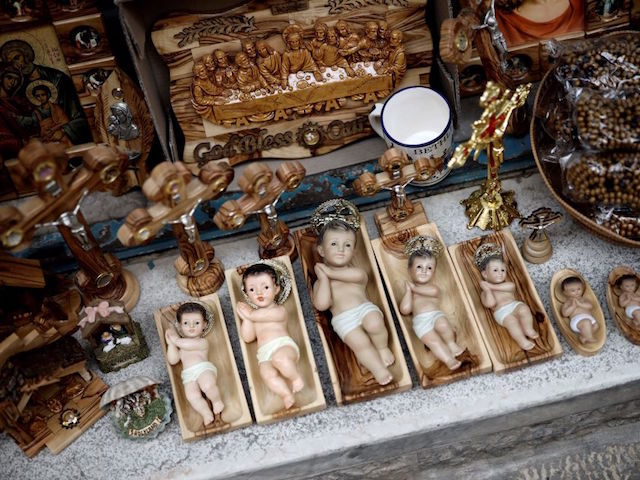 Christ Child figurines are displayed in a shop in the Biblical West Bank city of Bethlehem