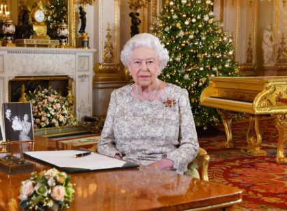 A picture released on December 24, 2018 shows Britain's Queen Elizabeth II posing for a photograph after she recorded her annual Christmas Day message, in the White Drawing Room of Buckingham Palace in central London. (Photo by John Stillwell / POOL / AFP) (Photo credit should read JOHN STILLWELL/AFP/Getty Images)