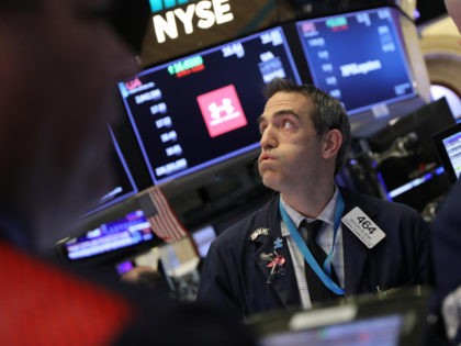 NEW YORK, NEW YORK - DECEMBER 19: Traders work on the floor of the New York Stock Exchange