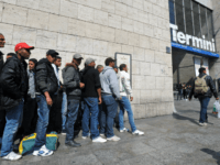 Tunisian would-be immigrants wait before boarding a train at Rome's Termini station to Ventimiglia, the Italian border town with France on April 21, 2011. Dozens out of the thousands who have fled from Tunisia to Italy by boat in recent weeks in the wake of the Jasmine Revolution in January …