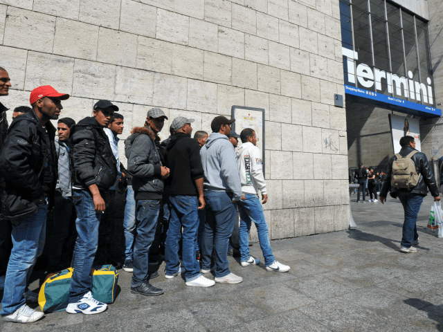 Tunisian would-be immigrants wait before boarding a train at Rome's Termini station t