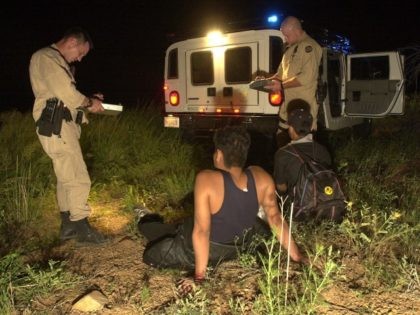 Border Patrol agents apprehend two illegal aliens.